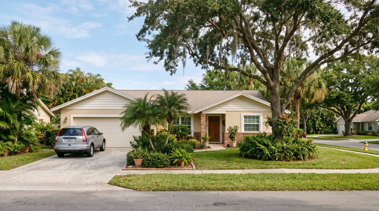 Golden-hour street in Davie with white ranch fencing, horses grazing, and mossy oak trees